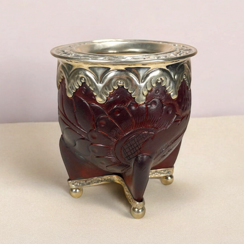 an imperial maté calabash. Engraved leather and hand-cut alpaca virola.